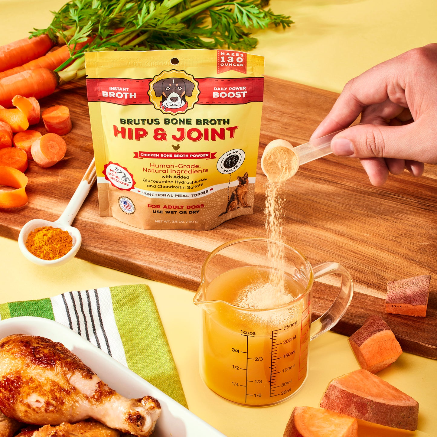 Pouring Brutus Bone Broth Hip & Joint Chicken Bone Broth Powder into 8 ounces of water