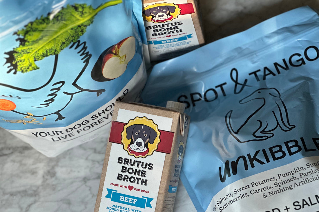 Brutus Bone Broth BEEF carton labeled MADE WITH FOR DOGS beside Spot & Tango bag reading YOUR DOG SHOULD LIVE FOREVER